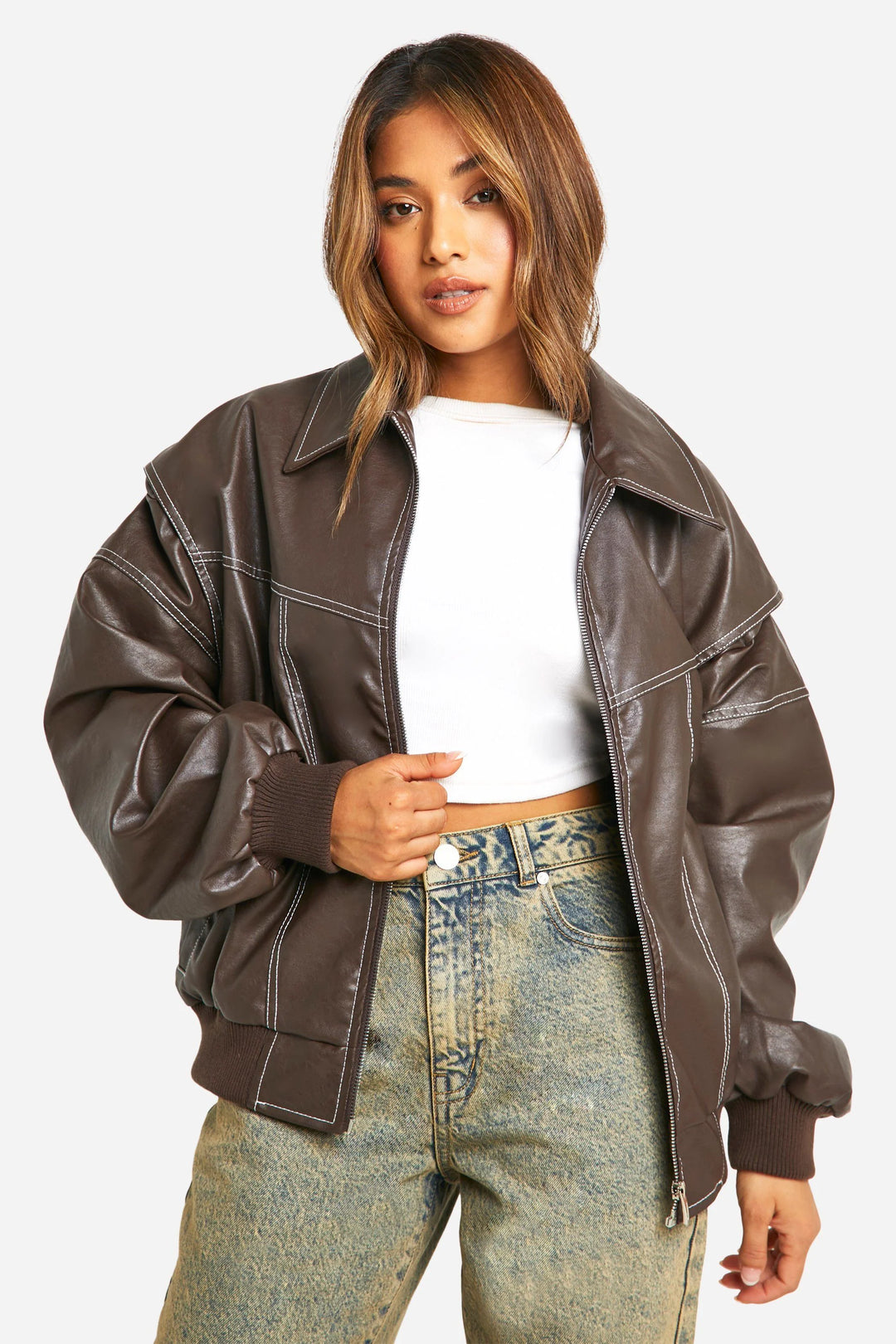 Woman in classic bomber jacket demonstrating oversized fit and contemporary silhouette
