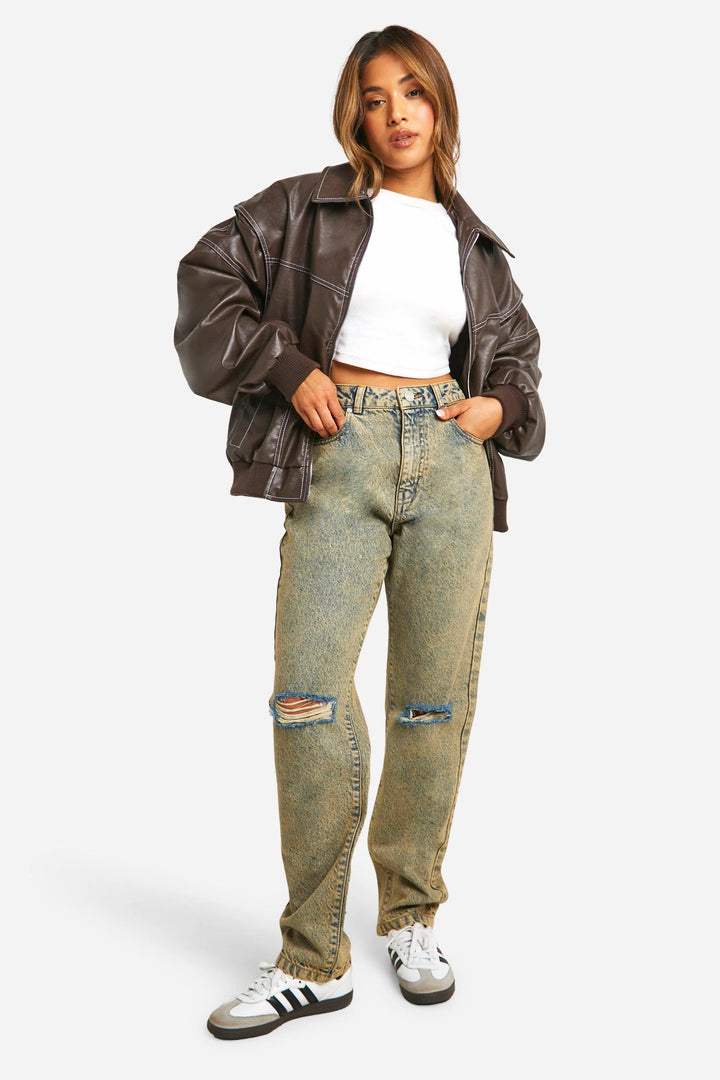 Woman wearing classic bomber jacket zipped up showing relaxed fit and ribbed cuffs