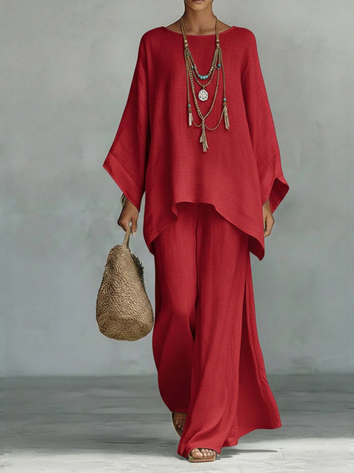 Women's oversized linen top with boat neckline paired with floor-length wide-leg trousers