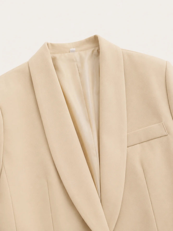 Side view showing flattering silhouette of belted blazer and wide leg trouser co-ord set