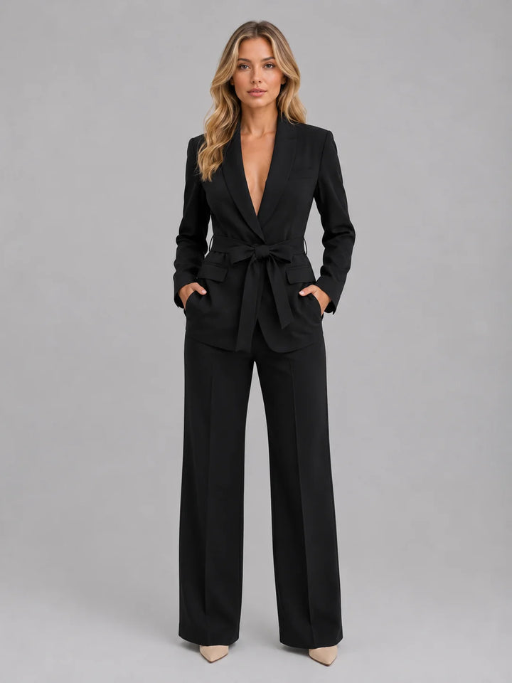 Back view of belted blazer showing structured construction and smooth finish