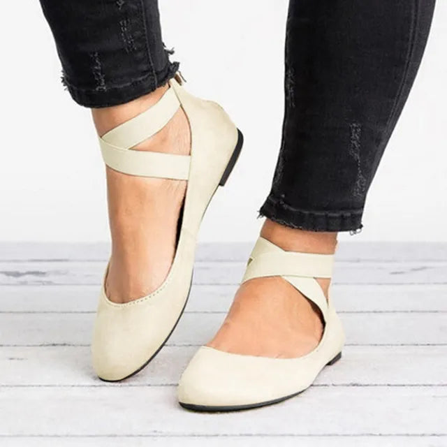 Women's cross-strap ballet flats in beige with elasticated ankle straps and rounded toe