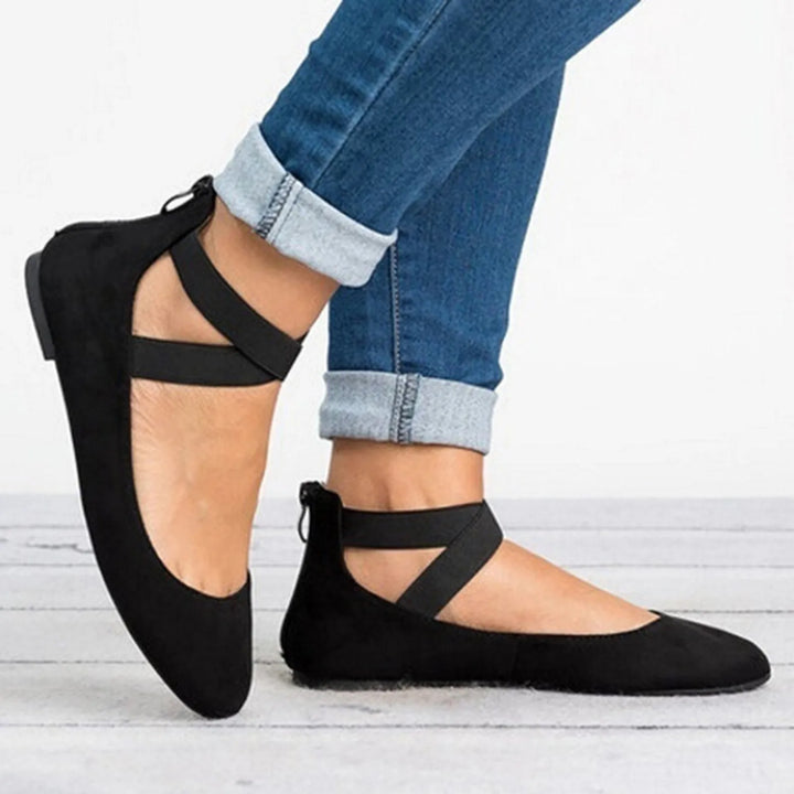 Rear view of women's cross-strap ballet flats showing ankle strap placement and fit