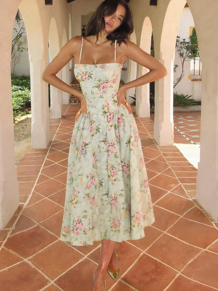 Women's Floral Strap Midi Wedding Guest Dress in soft pastel floral print with structured bodice and flowing midi skirt