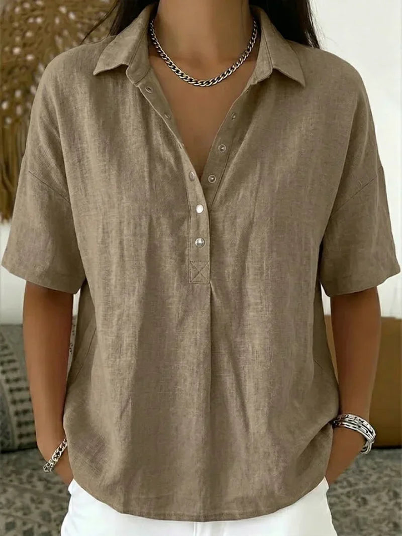 Close-up of women's linen shirt showing button placket detail and soft fabric drape