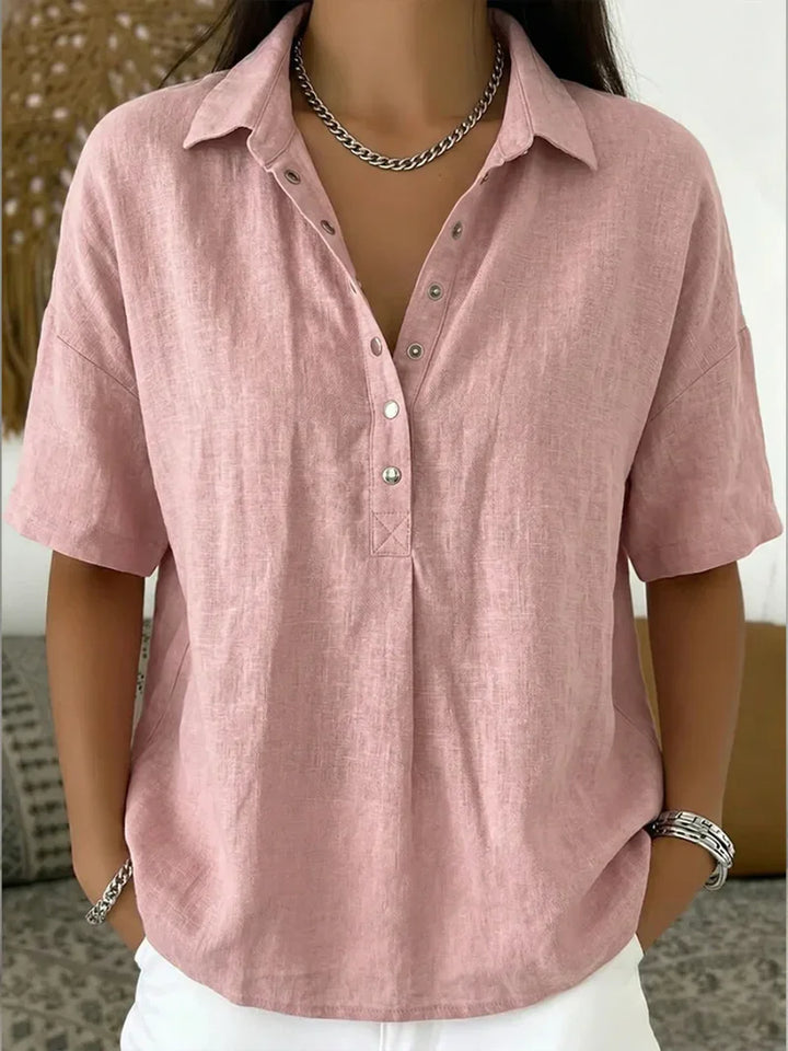Back view of women's linen shirt showing relaxed fit and shoulder drape