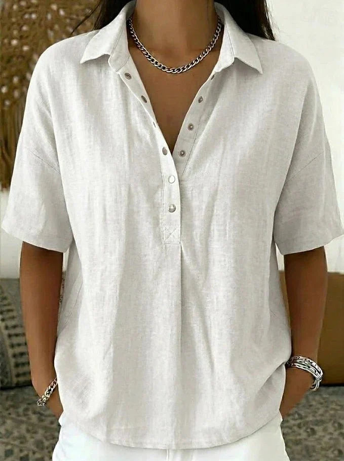 Full-length view of women's linen shirt paired with casual trousers