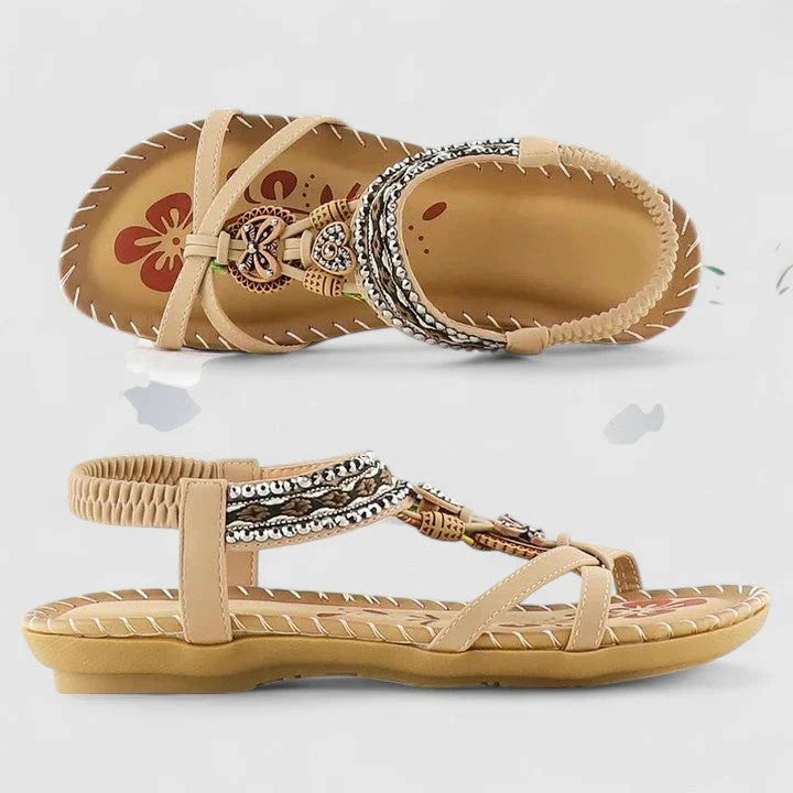 Women's embellished sandals shown from multiple angles displaying flat sole and secure ankle strap