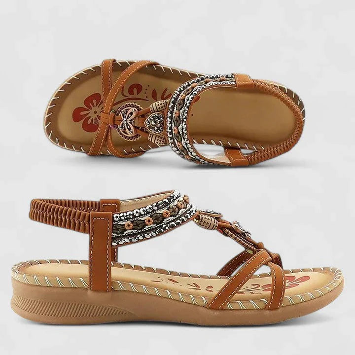 Women's flat sandals with elastic ankle strap and decorative beaded embellishments for summer wear
