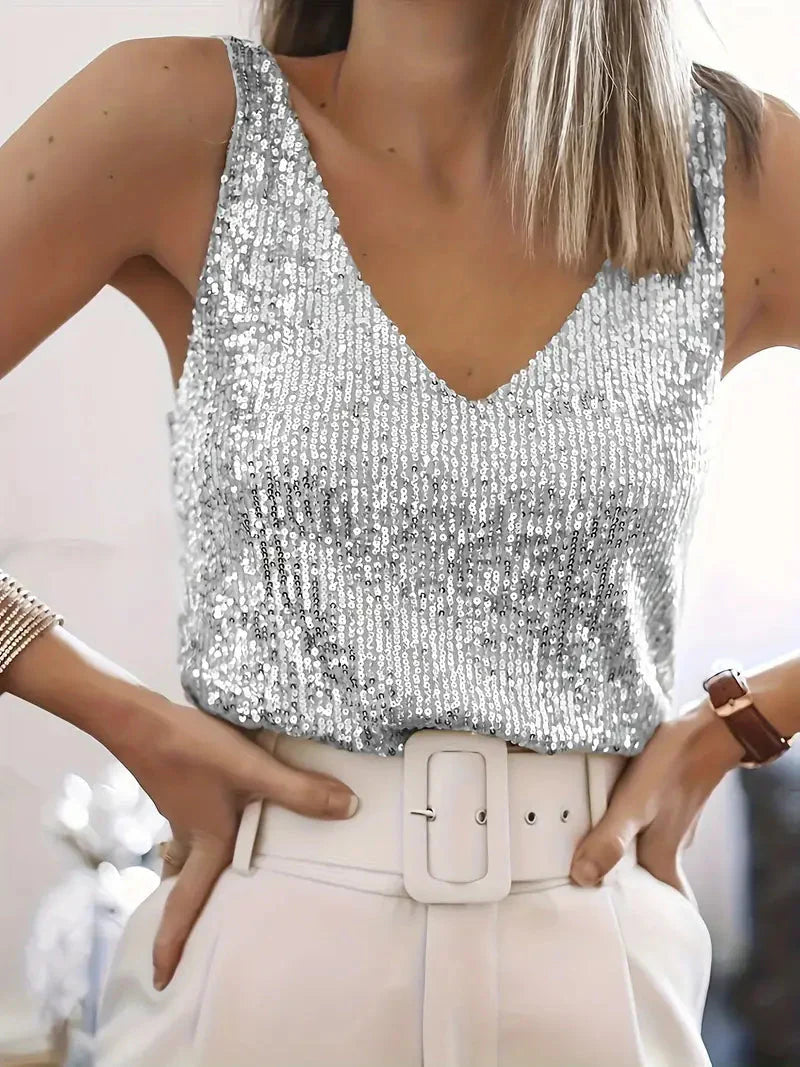 Side view of sleeveless sequin top displaying relaxed fit and structured silhouette