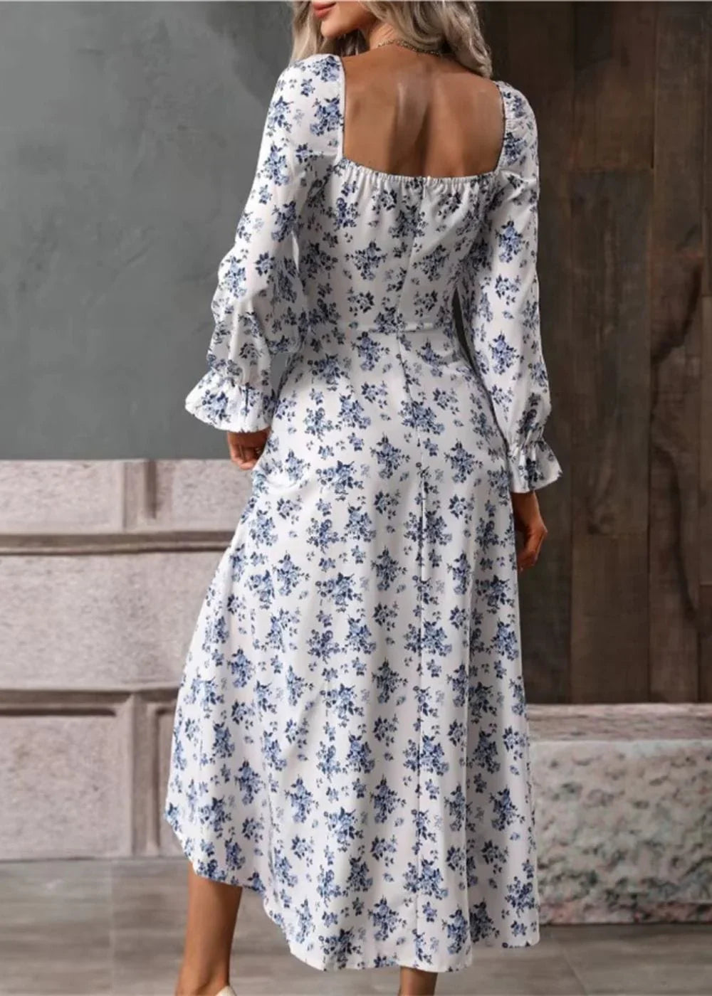 Close-up of floral square-neck dress showing empire waist and tie-front detail