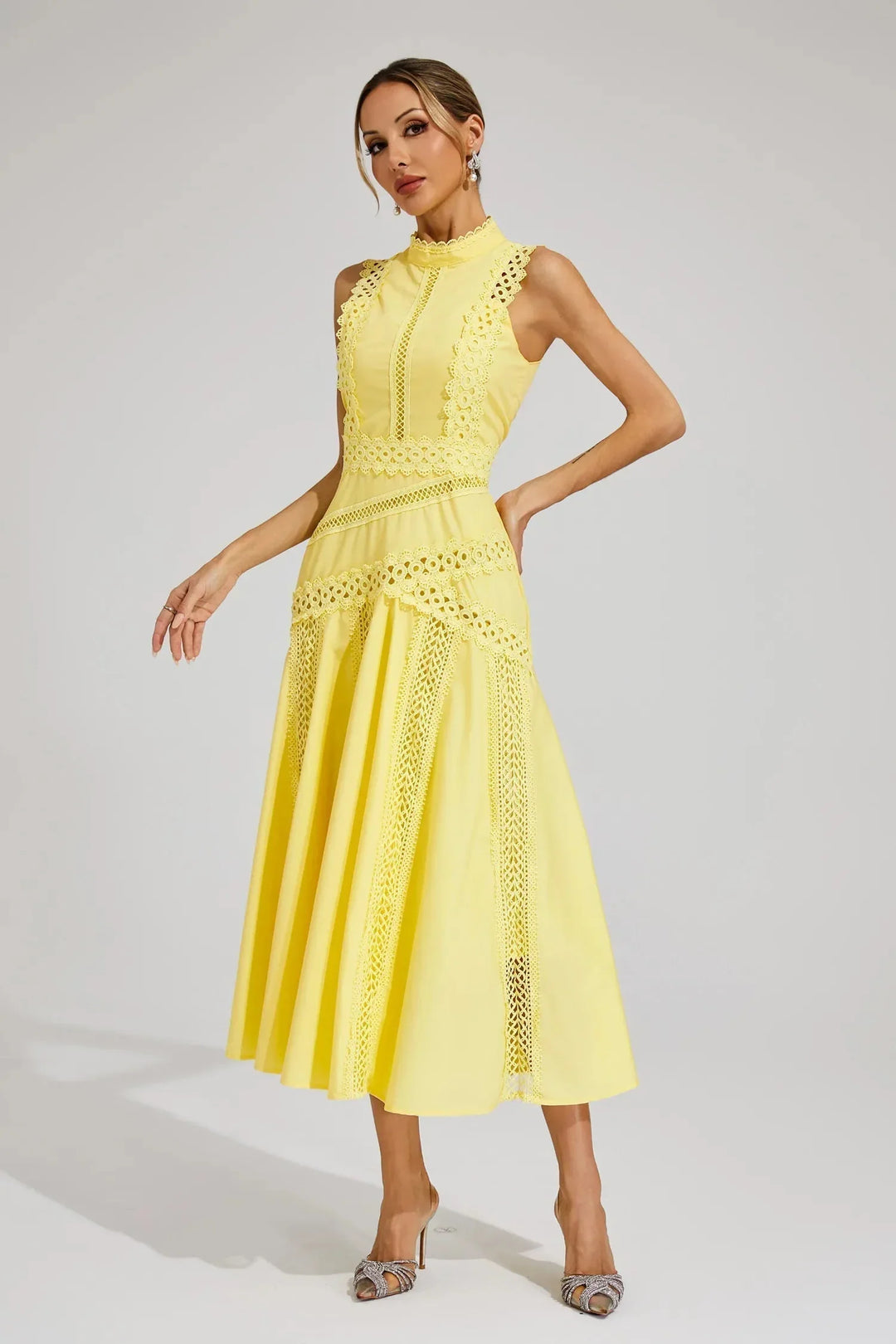Side angle of flared midi dress with textured lace panels and smooth finish