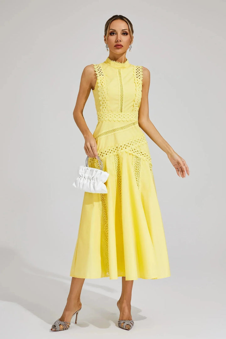 Detail shot of delicate lace pattern and high neckline on occasion midi dress