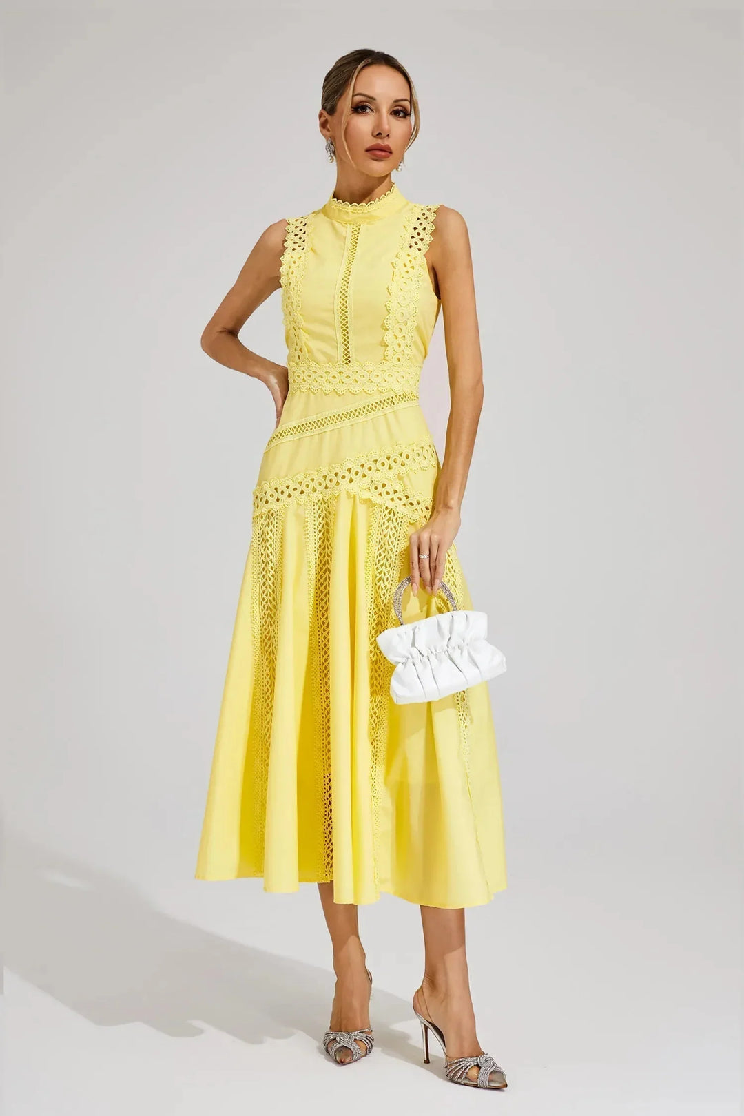 Back view showing centre zip fastening and lace panel detailing on midi dress