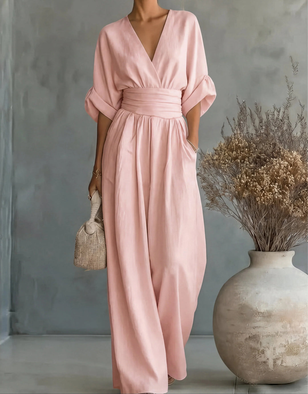 Green wide-leg jumpsuit showing relaxed fit and flowing silhouette