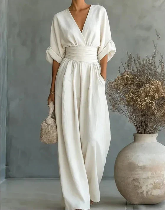 Wide-leg jumpsuit with short sleeves and V-neckline in cream colour