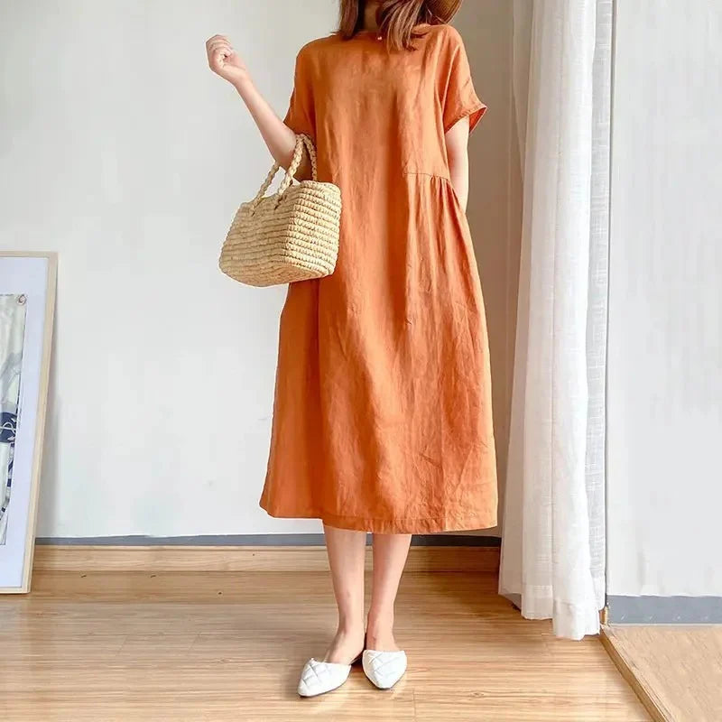 Full-length view of linen short sleeve midi dress paired with casual footwear for everyday wear