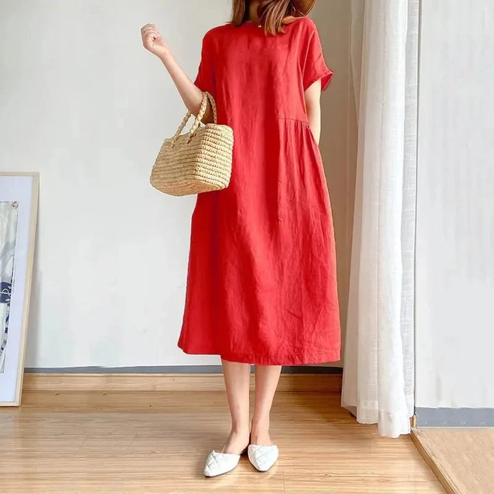 Linen short sleeve midi dress styled with accessories for versatile warm-weather dressing