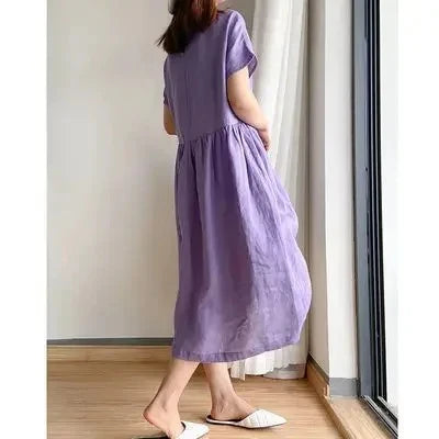 Relaxed fit linen midi dress showing comfortable silhouette and practical side pocket design