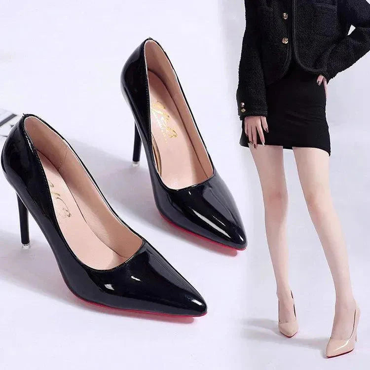 Pointed toe stiletto heels in glossy black patent finish with tapered heel and slip-on design