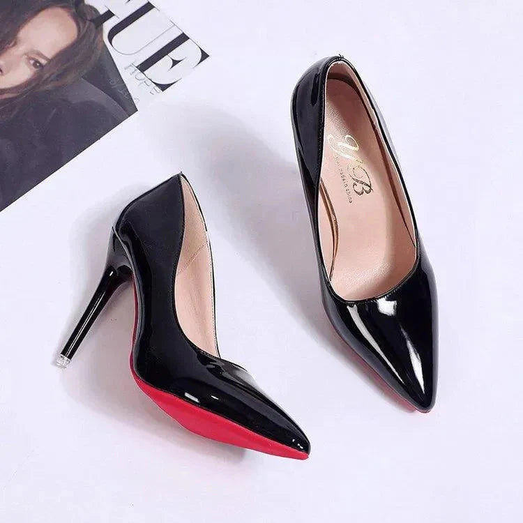 Close-up of pointed toe and glossy patent upper on stiletto heels