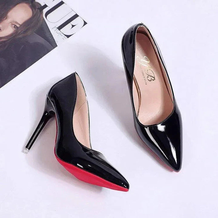 Close-up of pointed toe and glossy patent upper on stiletto heels