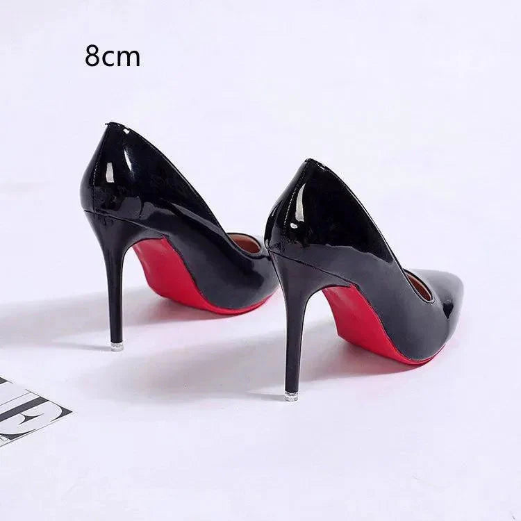Pointed toe stiletto heels styled for office wear with tailored trousers