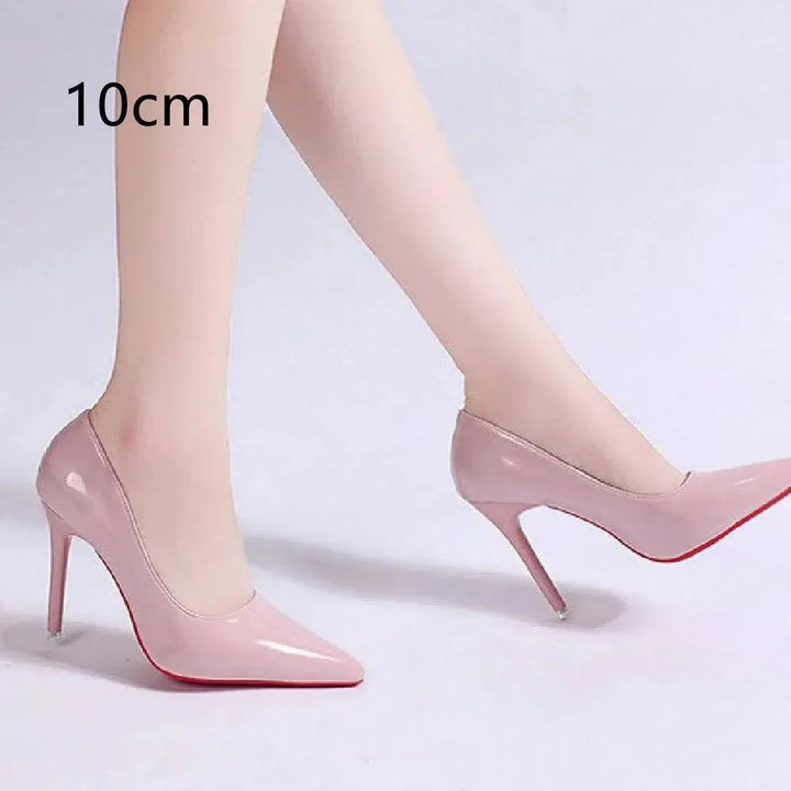 Detail of structured patent upper and tapered heel on pointed toe stiletto heels