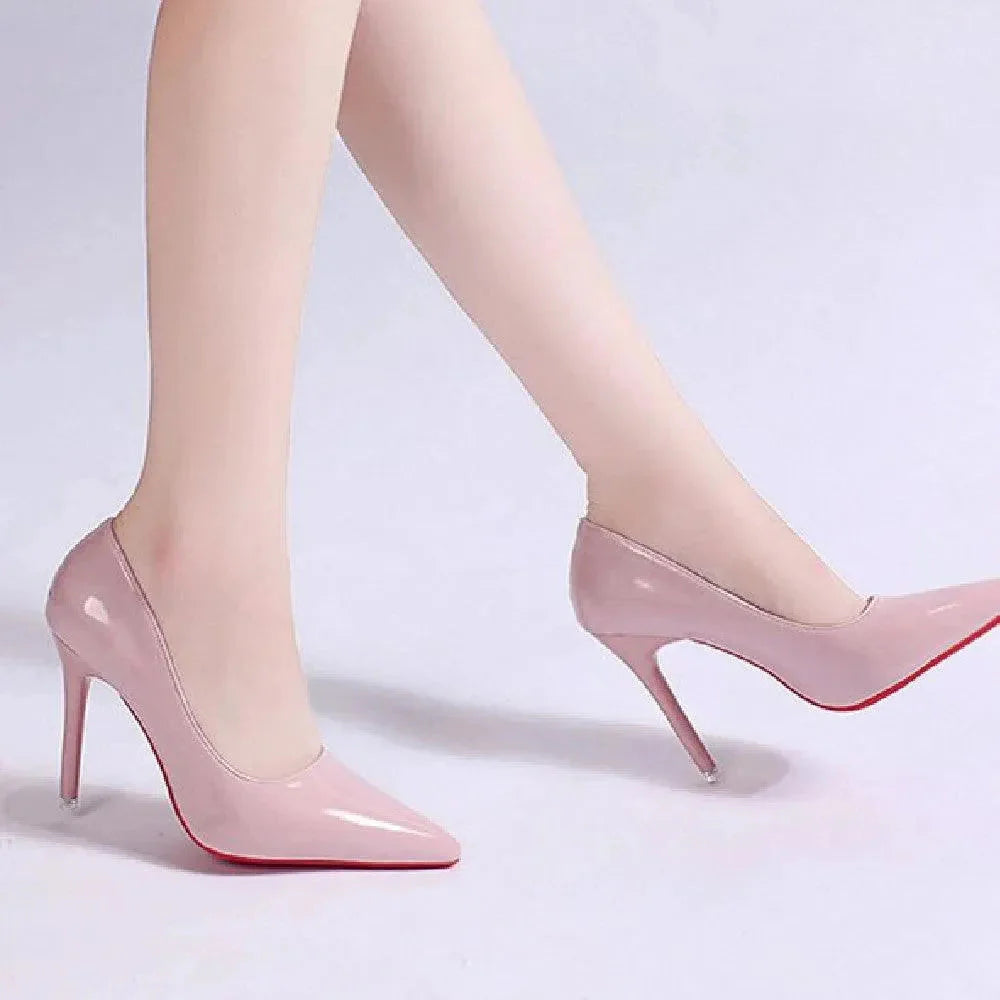 Full view of pointed toe stiletto heels with glossy finish and streamlined silhouette