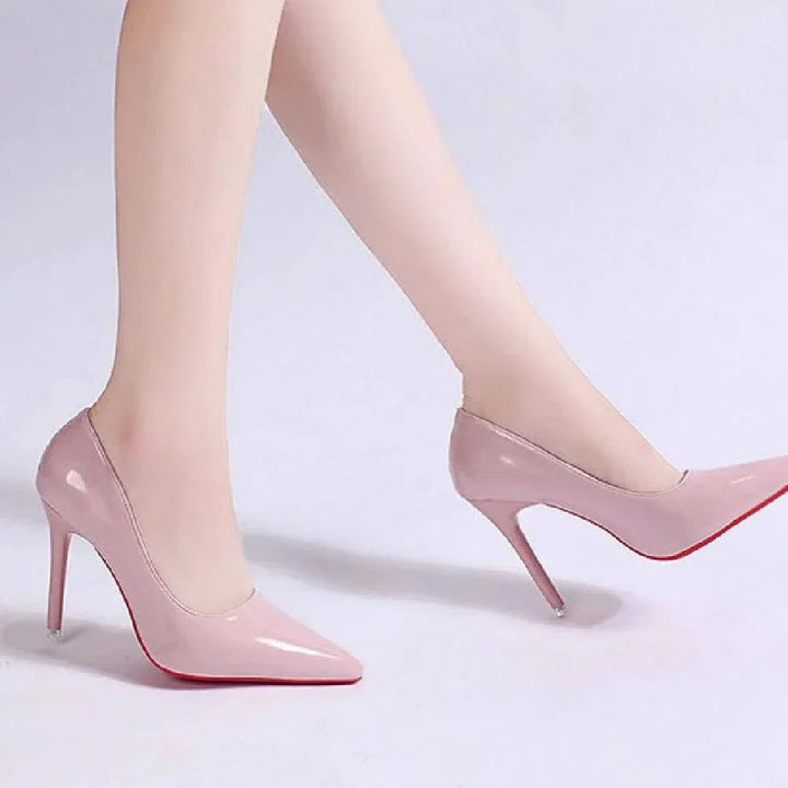 Full view of pointed toe stiletto heels with glossy finish and streamlined silhouette