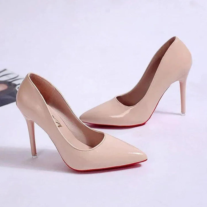 Side angle of pointed toe stiletto heels displaying low-cut vamp and heel height