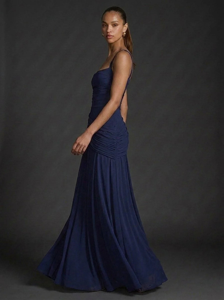 Detail shot of square neckline and thick straps on ruched formal maxi dress
