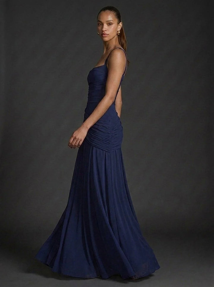 Detail shot of square neckline and thick straps on ruched formal maxi dress