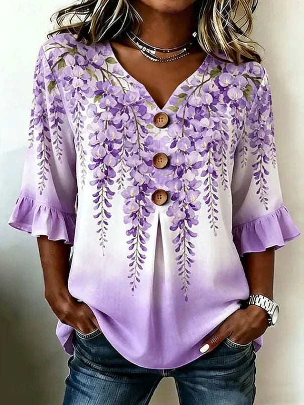 Close-up view of the patchwork floral design and button-front detail on the Bohemian Floral Button Blouse