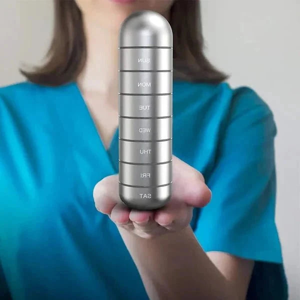 Weekly medication organiser with aluminium body and attached carry strap for convenient on-the-go dosing