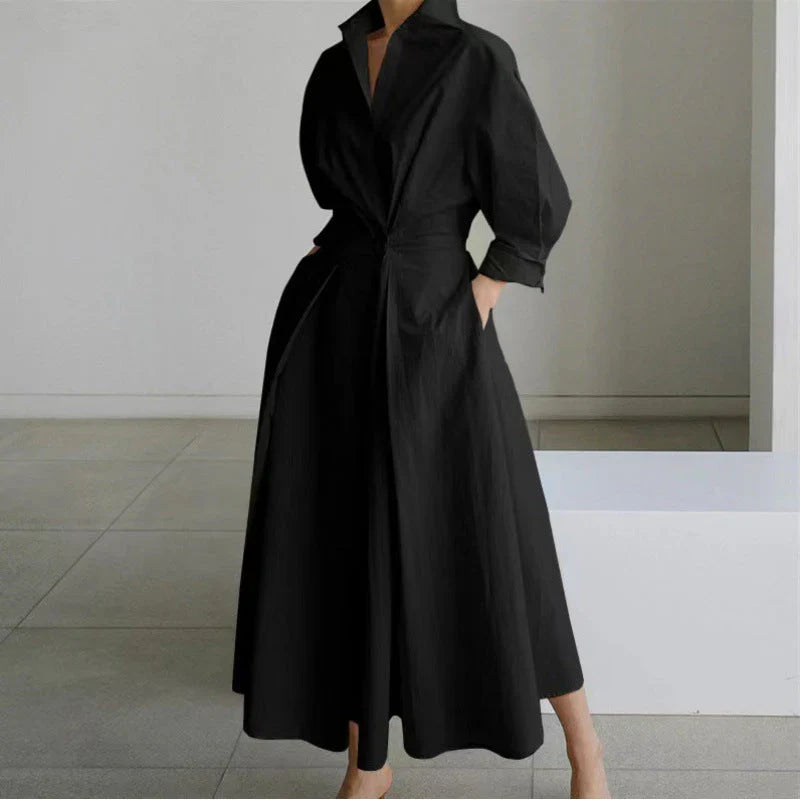 Collared wrap maxi dress styled for daytime wear with minimalist accessories and neutral backdrop