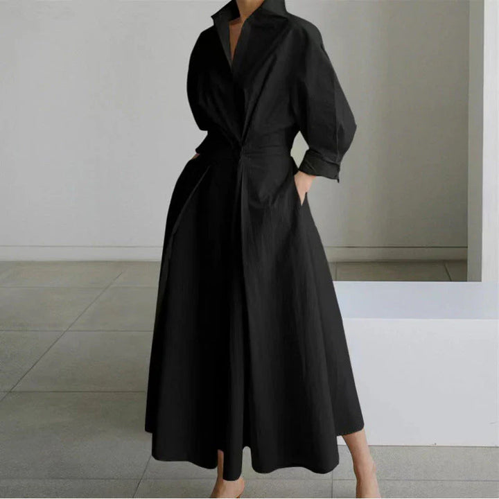 Collared wrap maxi dress styled for daytime wear with minimalist accessories and neutral backdrop