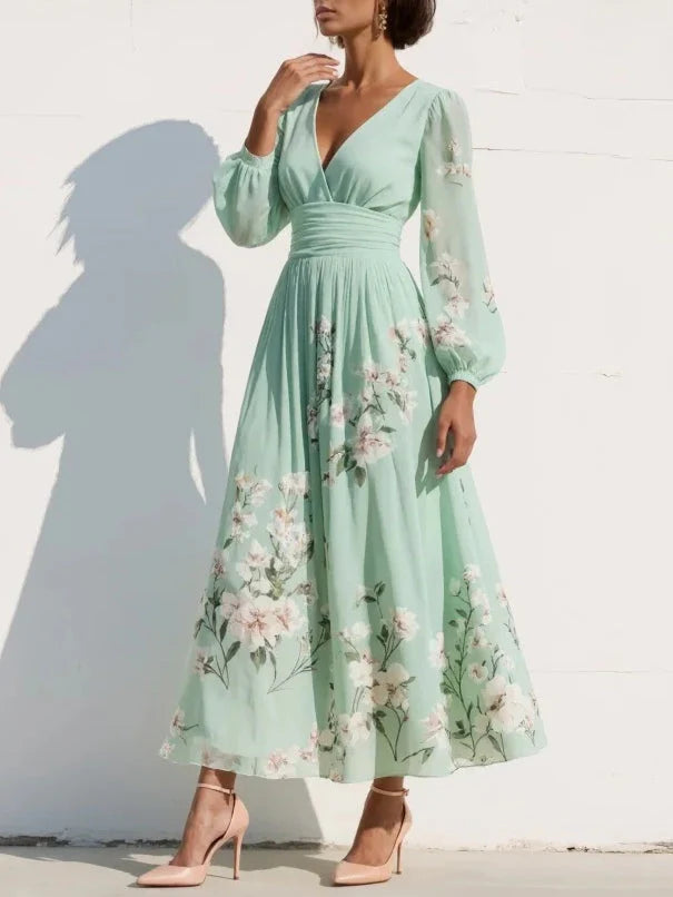 Close-up of floral midi dress showing delicate embroidered detail and flowing A-line skirt