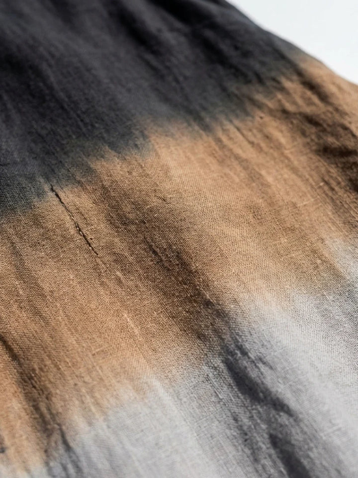Detail shot of ombre dress neckline and shoulder area showing smooth fabric finish