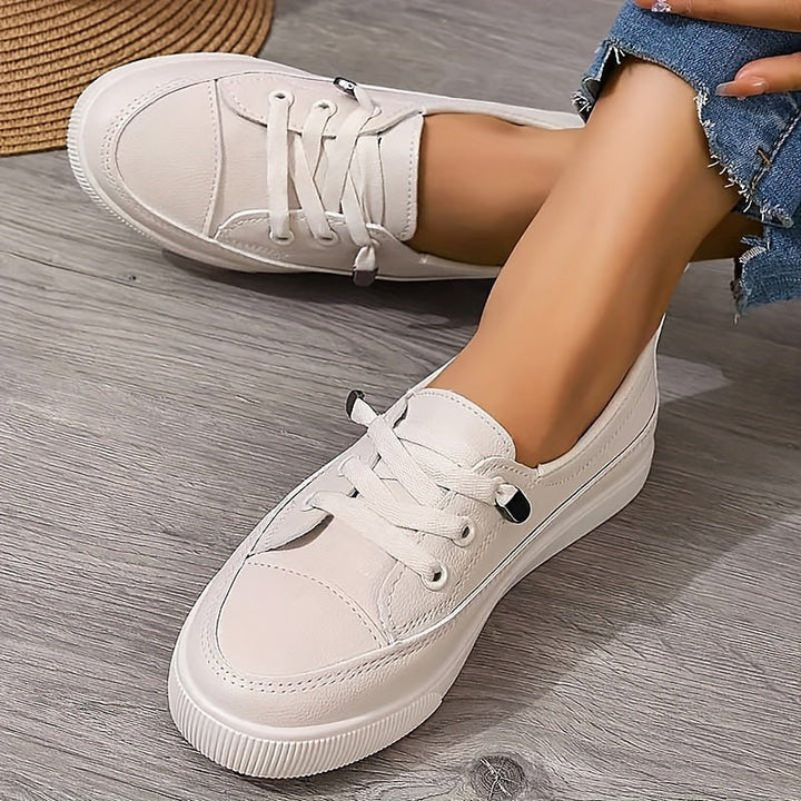 Side profile of Women's Orthopedic Trainers featuring slip-resistant rubber outsole and lace-up front closure