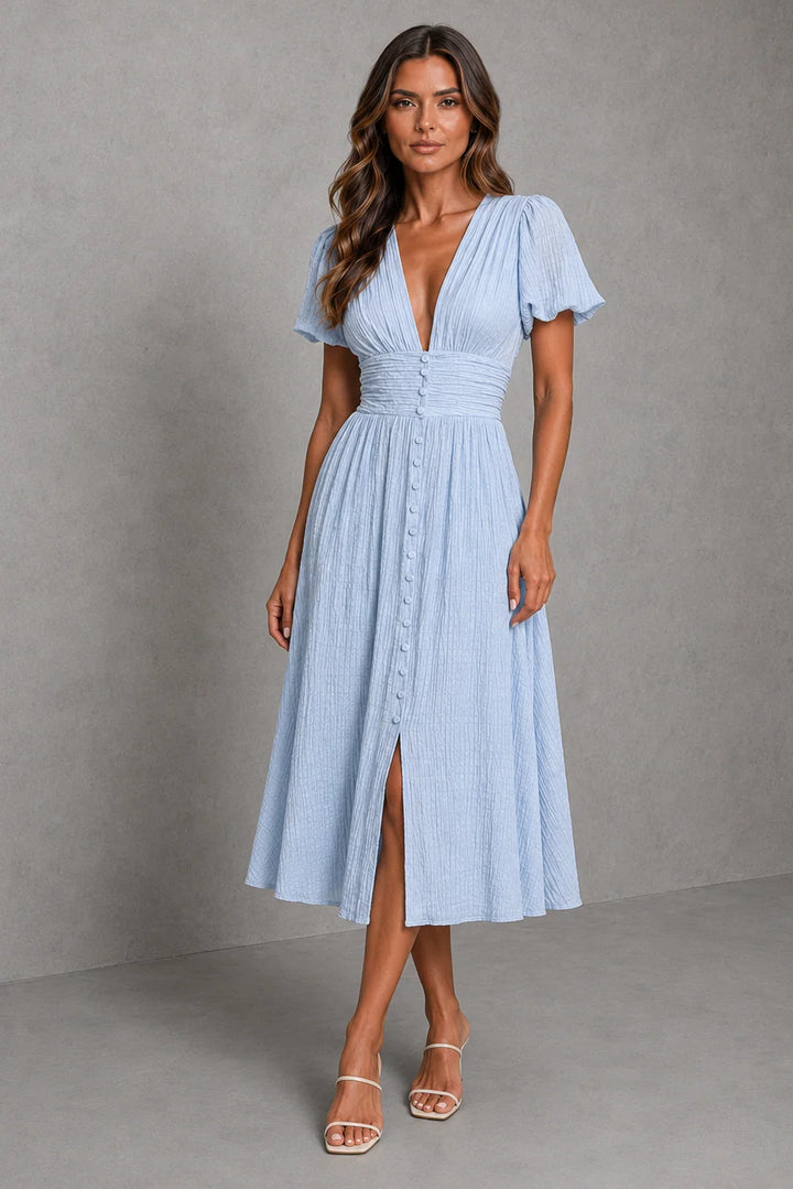 Light blue midi dress with puff sleeves, deep V-neckline, and button-through front detail for summer occasions