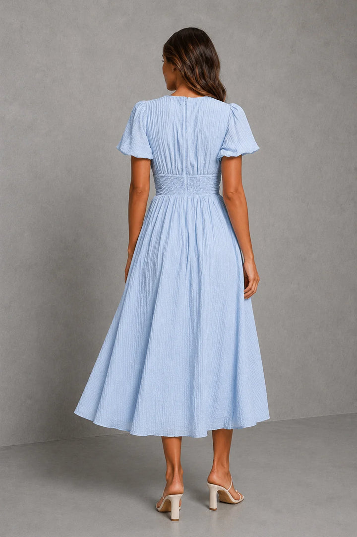 Women's casual summer midi dress with fitted bodice, puff sleeves, and centre split skirt in pale blue