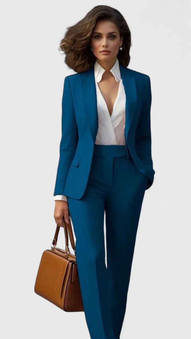 Full-length view of women's tailored suit set in coral showing complete coordinated look