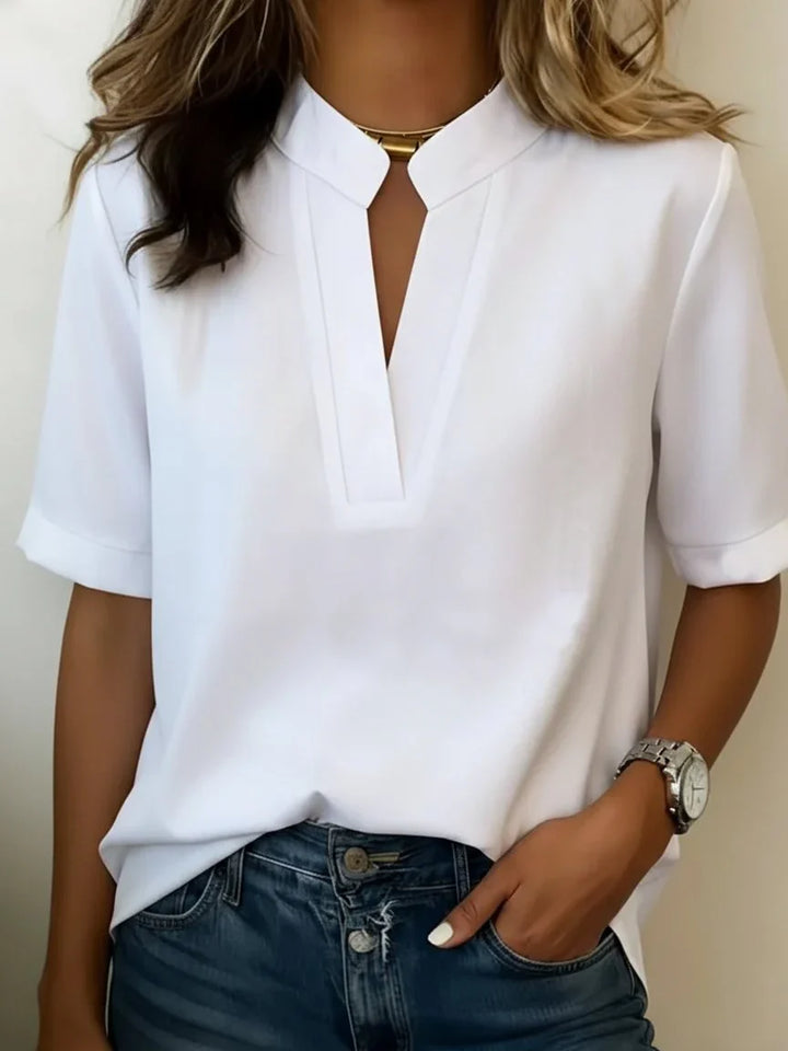 Full length view of relaxed women's blouse with short sleeves and comfortable non-clinging fit