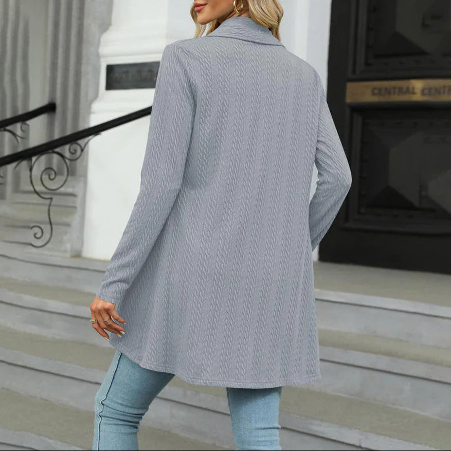Close-up view of women's open front cardigan showing draped shawl collar and textured woven finish