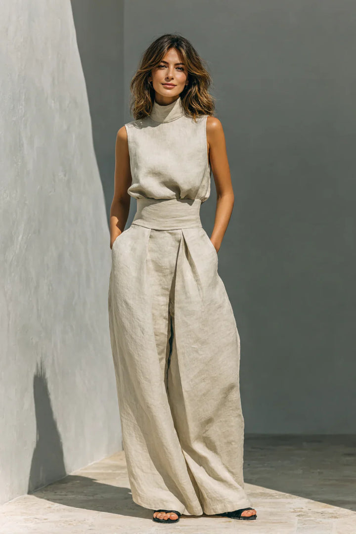 Women's sleeveless wide leg trouser set in beige with high neck top and flowing trousers