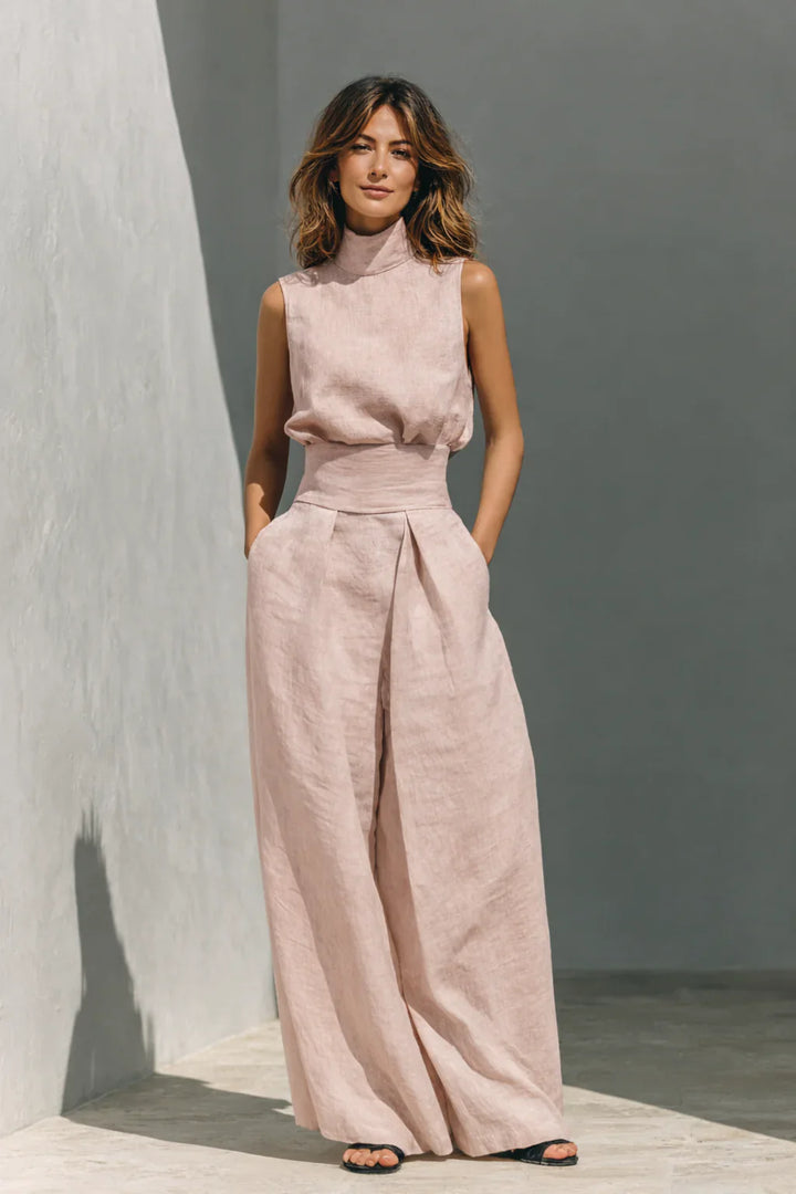 Two piece trouser set featuring relaxed blouson top and wide leg trousers with front pleats