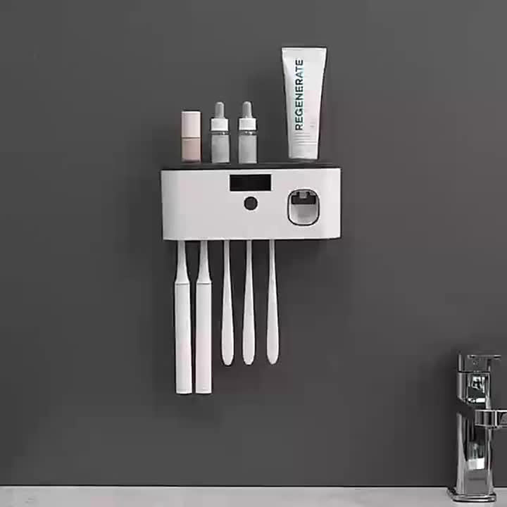 Wall-mounted toothbrush holder with automatic toothpaste dispenser and shelf
