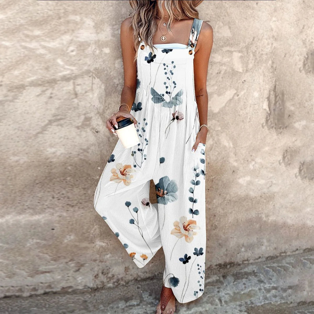 Relaxed fit dungarees featuring oversized daisy print and side pockets