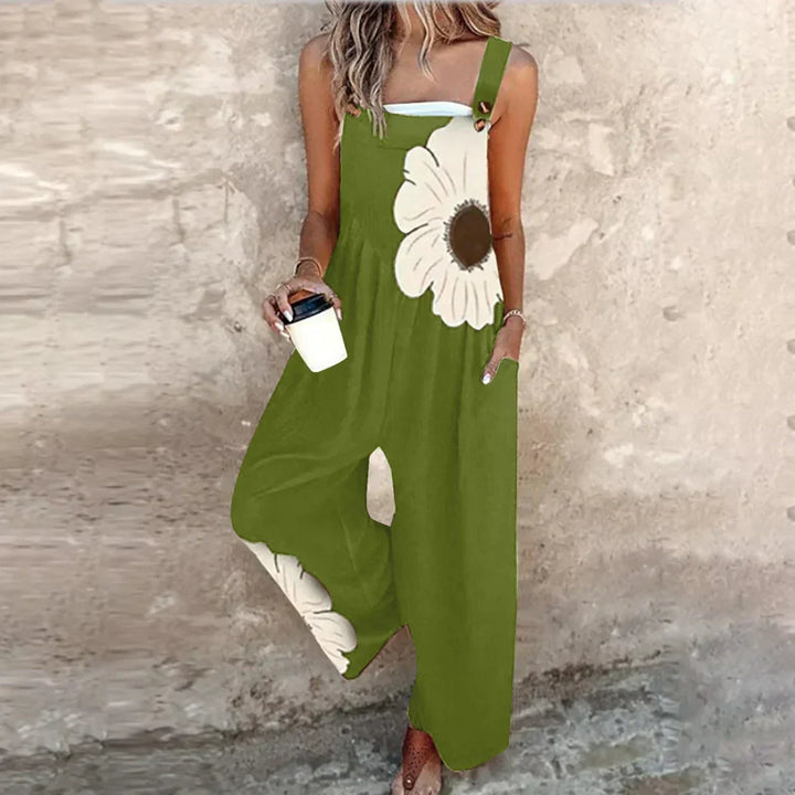 Wide leg dungarees with large flower print and adjustable metal strap hardware